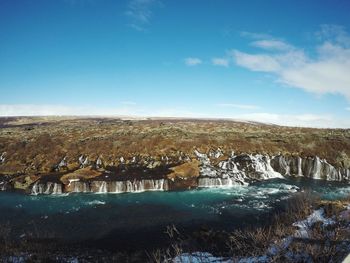 Scenic view of landscape against blue sky