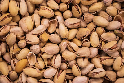 Background of fried pistachios. nuts for a vegetarian diet.