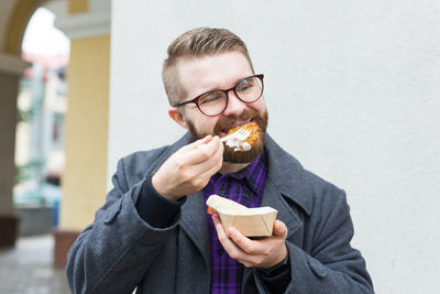 Portrait of man eating food