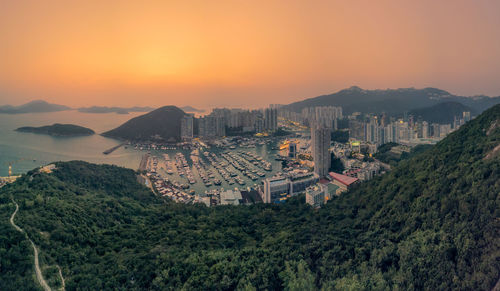 High angle view of city at sunset