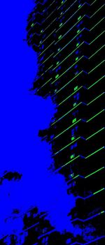 Low angle view of illuminated building against blue sky