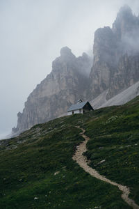 Hiking through the fog in drei zinnen nature park, south tyrol, italy