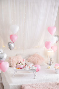 Pink flowers in vase on table