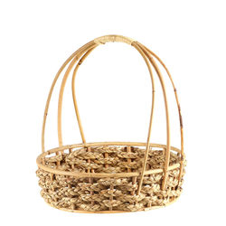 Close-up of wicker basket on glass against white background
