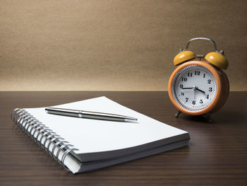 High angle view of clock on table