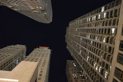 Exterior of modern buildings in city at night