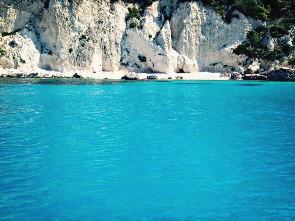 water, blue, sea, beach, shore, tranquility, high angle view, nature, day, beauty in nature, horizon over water, tranquil scene, outdoors, turquoise colored, no people, coastline, rippled, scenics, sand, idyllic