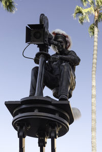 Low angle view of statue against sky