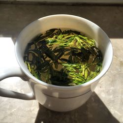 High angle view of chinese tea in cup on table