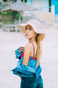 Portrait of a beautiful young woman looking away