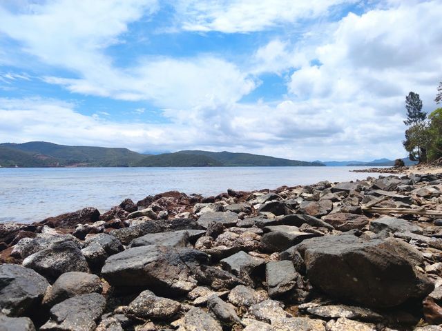 Rocks On Beach Against Sky Id