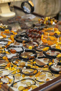 Colorful showcases of traditional jewelry stores and amber gemstone products in city market square