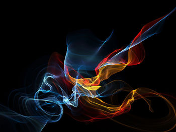 Close-up of light painting against black background