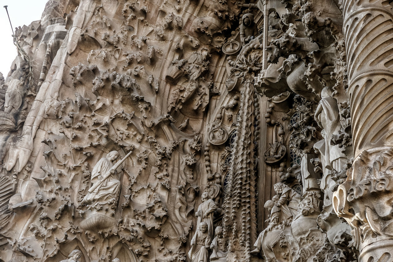 LOW ANGLE VIEW OF CARVINGS ON WALL
