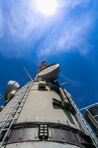 Low angle view of traditional windmill against sky