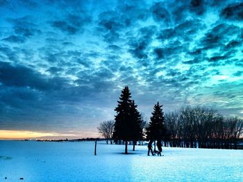 Scenic view of landscape against cloudy sky