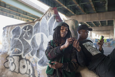 Two young men at a skateboard park.