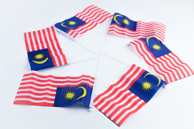 High angle view of flags against white background