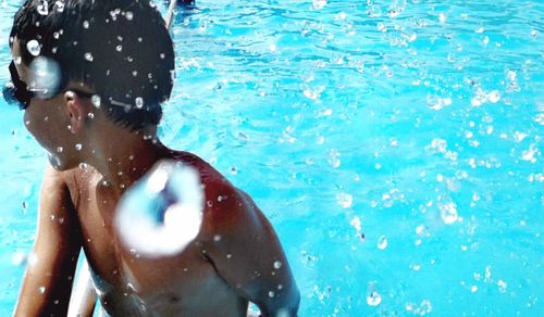 Man swimming in pool