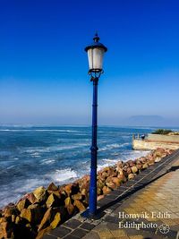 Street light against sky