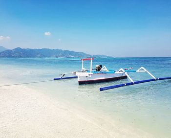 Fishing boat against blue sky