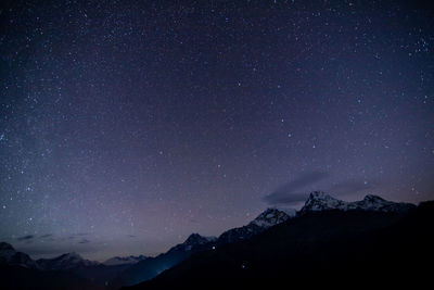 Early morning mountains peaks and shinning stars at 3am.