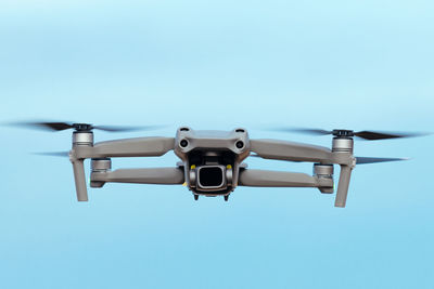 Low angle view of airplane flying against clear sky