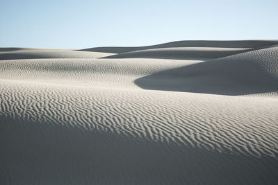 Scenic view of desert against clear sky