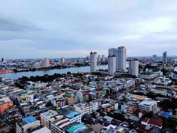 High angle view of city buildings against sky