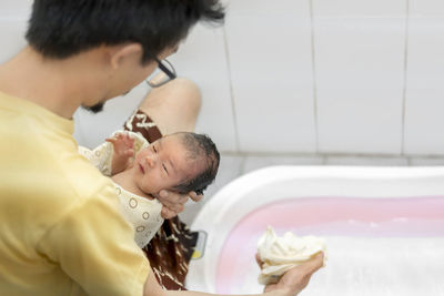 Midsection of mother with daughter