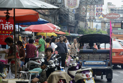 People at market in city