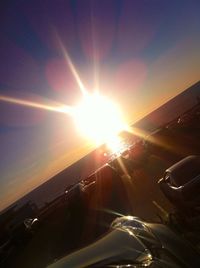 Car on road at sunset