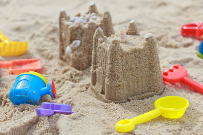 Close-up of sandcastles on beach