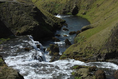 Stream flowing through rocks