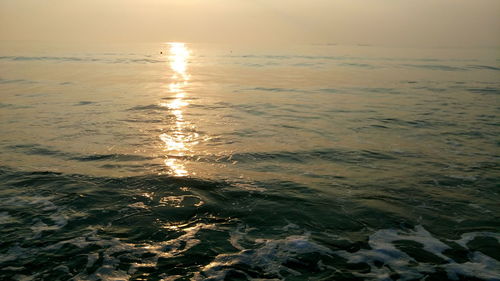 Scenic view of sea at sunset