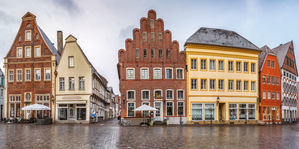 View of buildings against cloudy sky