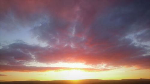 Scenic view of dramatic sky during sunset