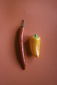 Close-up of yellow chili peppers on table