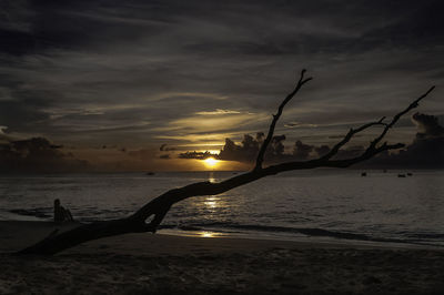 Scenic view of beach against sky during sunset