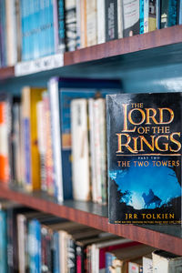Close-up of text on books in shelf