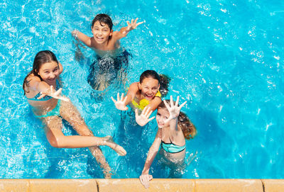 High angle view of woman swimming in pool