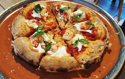 High angle view of pizza in plate on table