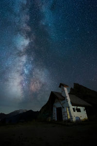 Low angle view of building against sky at night