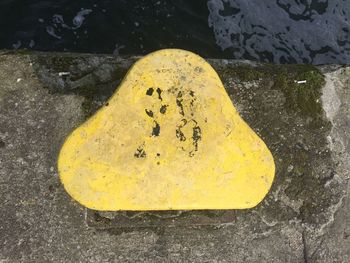 High angle view of yellow text on street