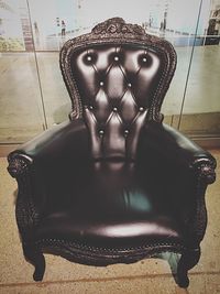 Portrait of young man sitting on armchair