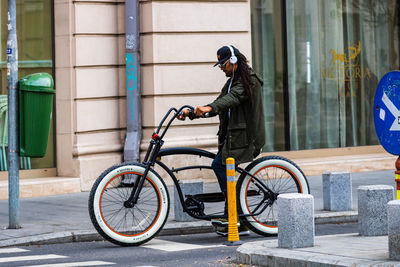 Man riding bicycle on street