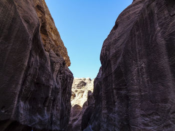 Low angle view of rock formations against sky