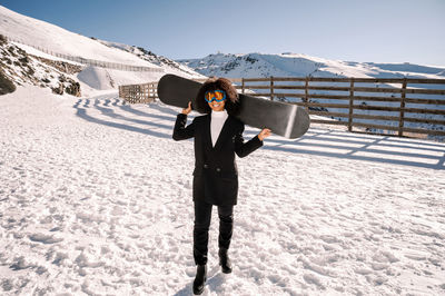 Man standing on snowcapped mountain