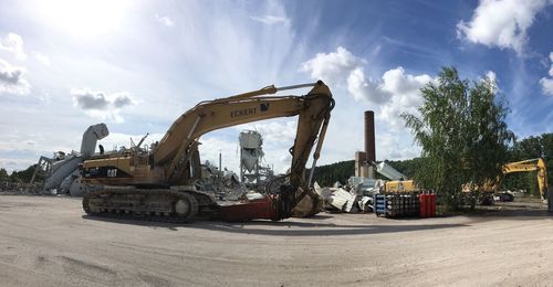 View of construction site against cloudy sky