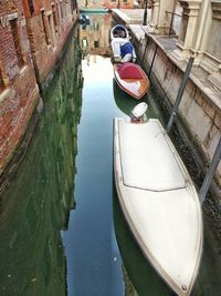 High angle view of boats moored in canal